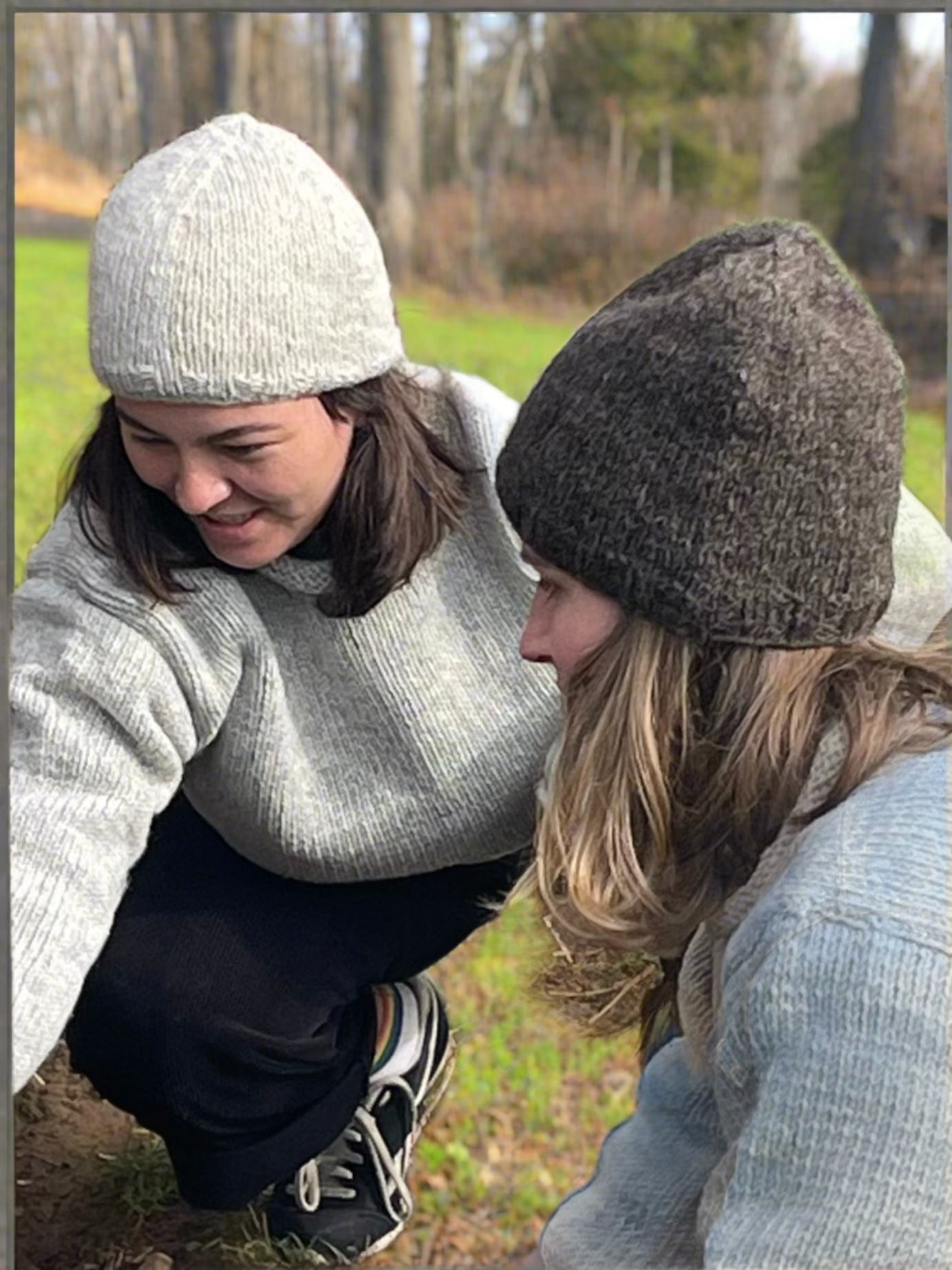 Two women in woolen hats and jumpers 